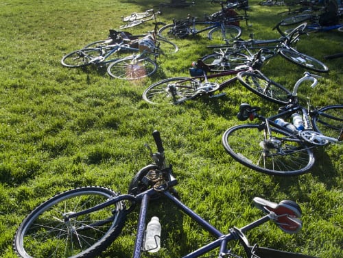 Pile of bikes in grass